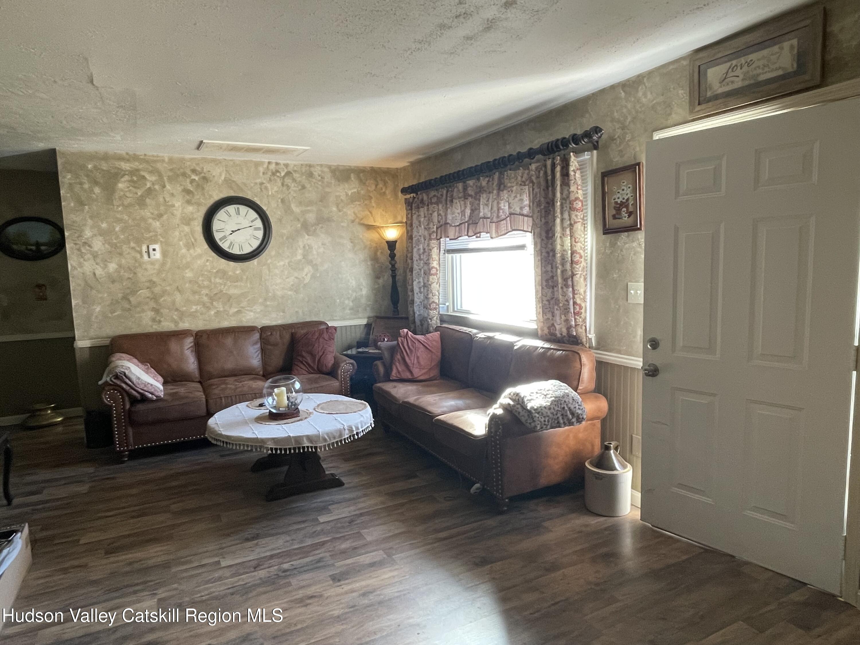 10 Johns Road Kerhonkson, NY 12446 - Photo 10 of 30 a living room with furniture and a wooden floor