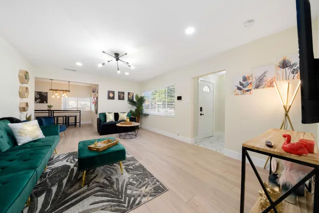 a living room with furniture and a table