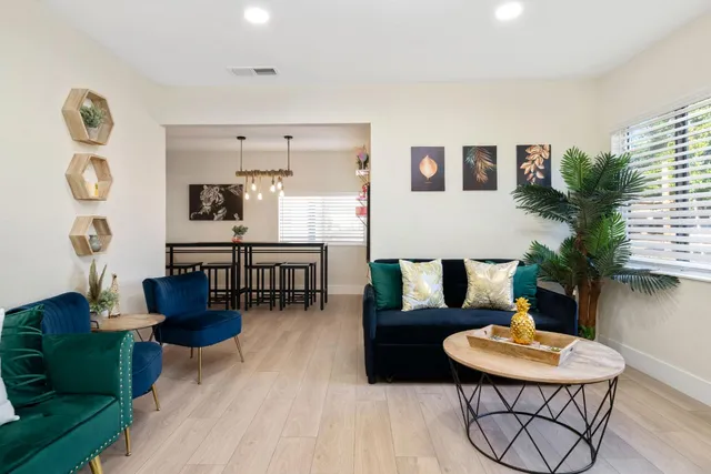 a kitchen with stainless steel appliances a sink stove and refrigerator