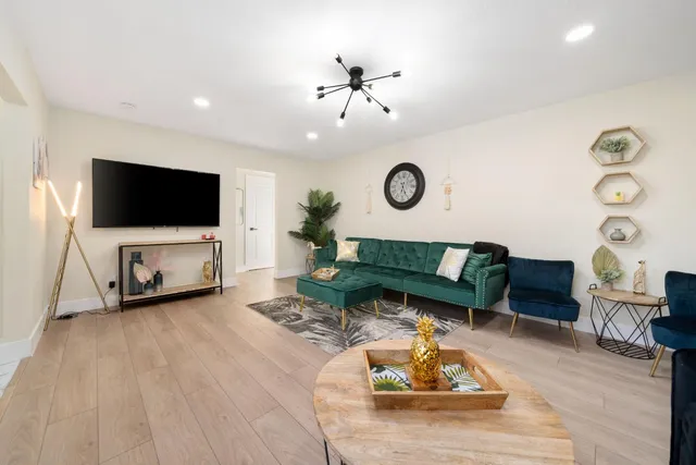 a kitchen with stainless steel appliances granite countertop a stove a sink and a granite counter tops