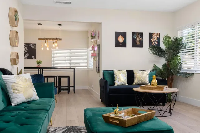 a kitchen with stainless steel appliances granite countertop a stove and a refrigerator