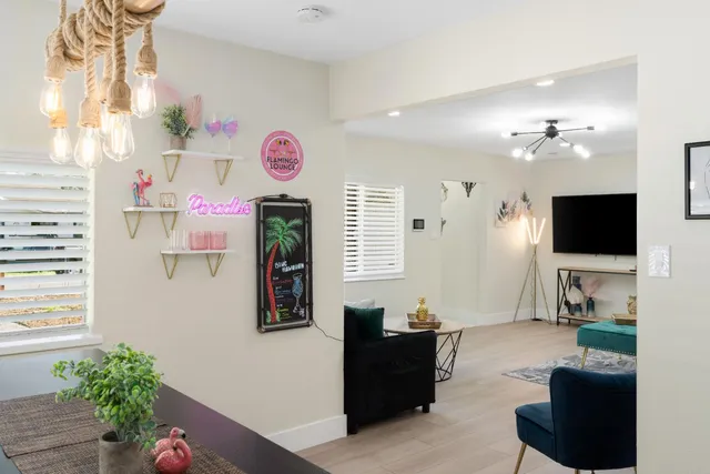a living room with furniture a rug and a window