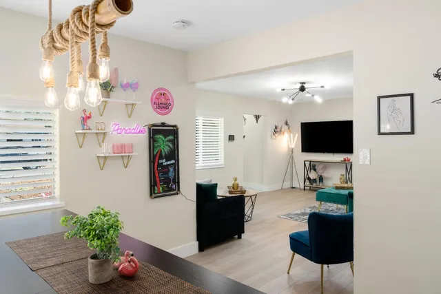 a dining room with furniture and wooden floor