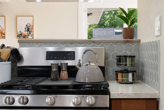 a bed room with a bed and a white couch