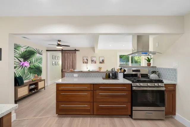 a bedroom with a bed and wall painting on the wall
