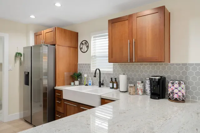 a bedroom with bed and painting on the wall