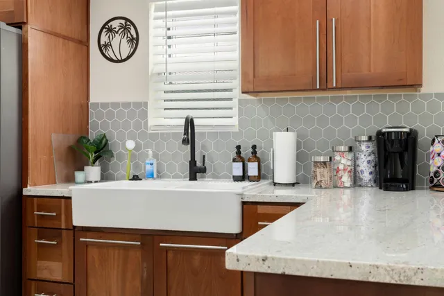 a backyard of a house with table and chairs