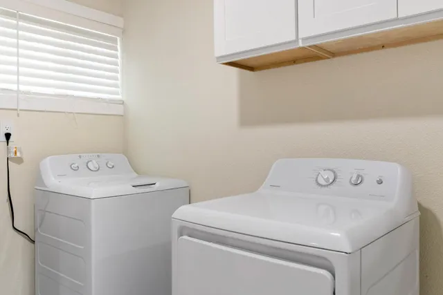 a view of swimming pool with a patio and a yard