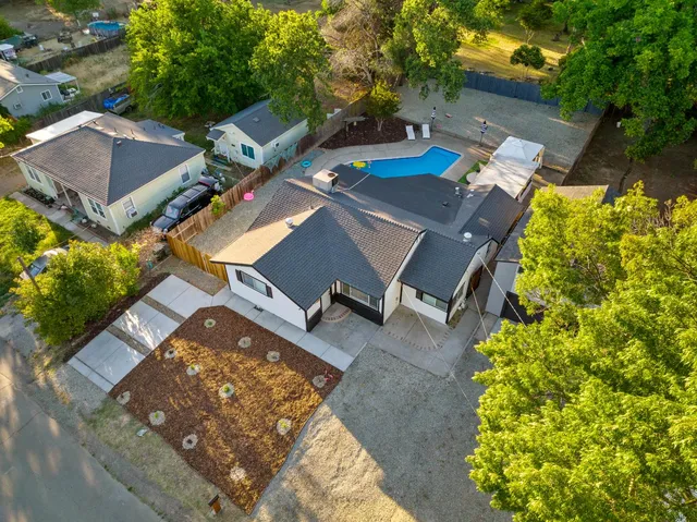 a view of a swimming pool with lounge chairs