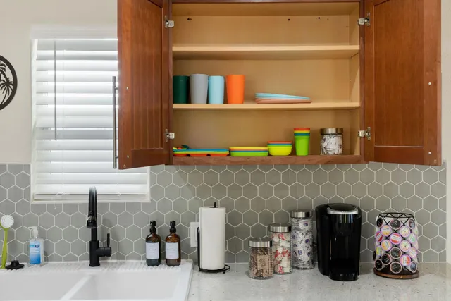 a living room with furniture gym equipment and a window