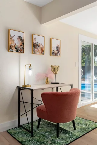 a living room with a couch and dresser