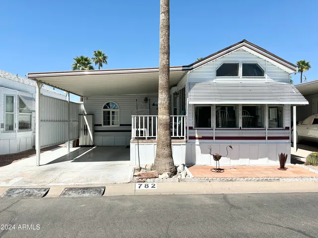 a front view of a house with garage