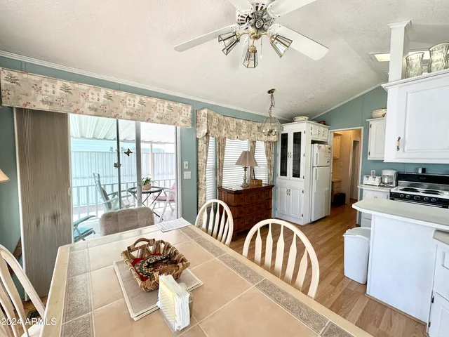 a living room with furniture and large windows