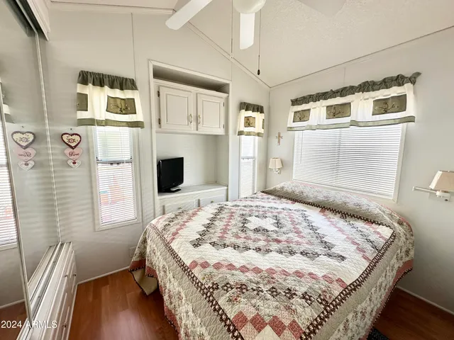 a view of house with backyard and deck