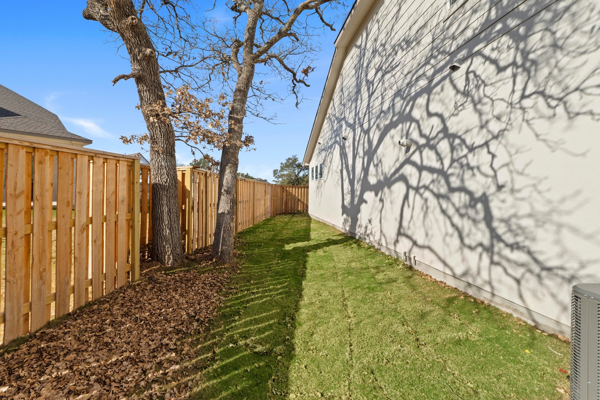 604 Lightstone Drive Georgetown, TX 78633 - Photo 34 of 39 a backyard of a house with table and chairs