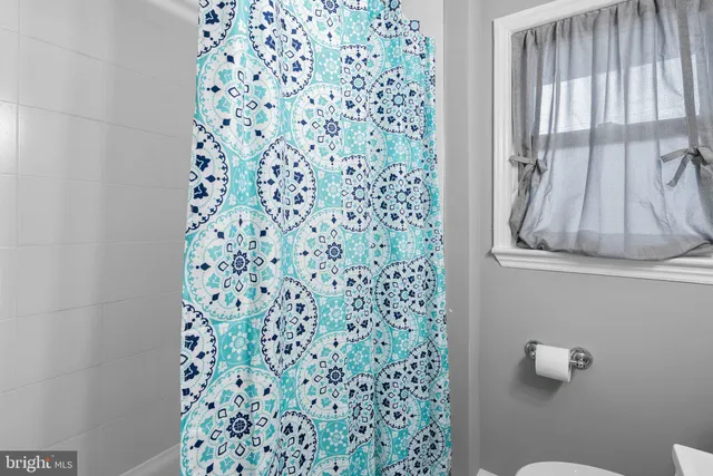 a bathroom with a shower curtain