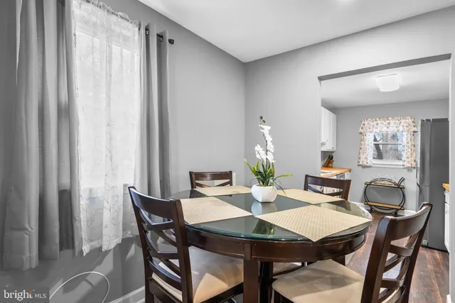 a view of a dining room with furniture and window