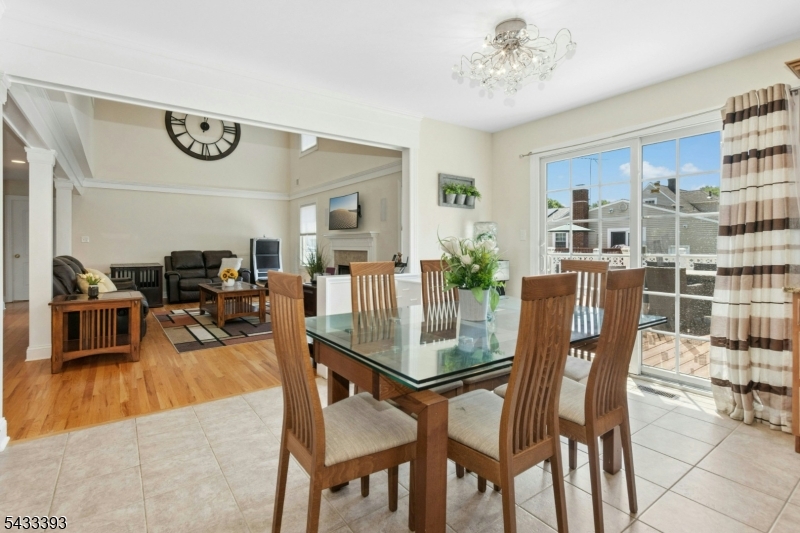 33 Stanton Street Clark, NJ 07066 - Photo 9 of 37 a view of a dining room with furniture and wooden floor