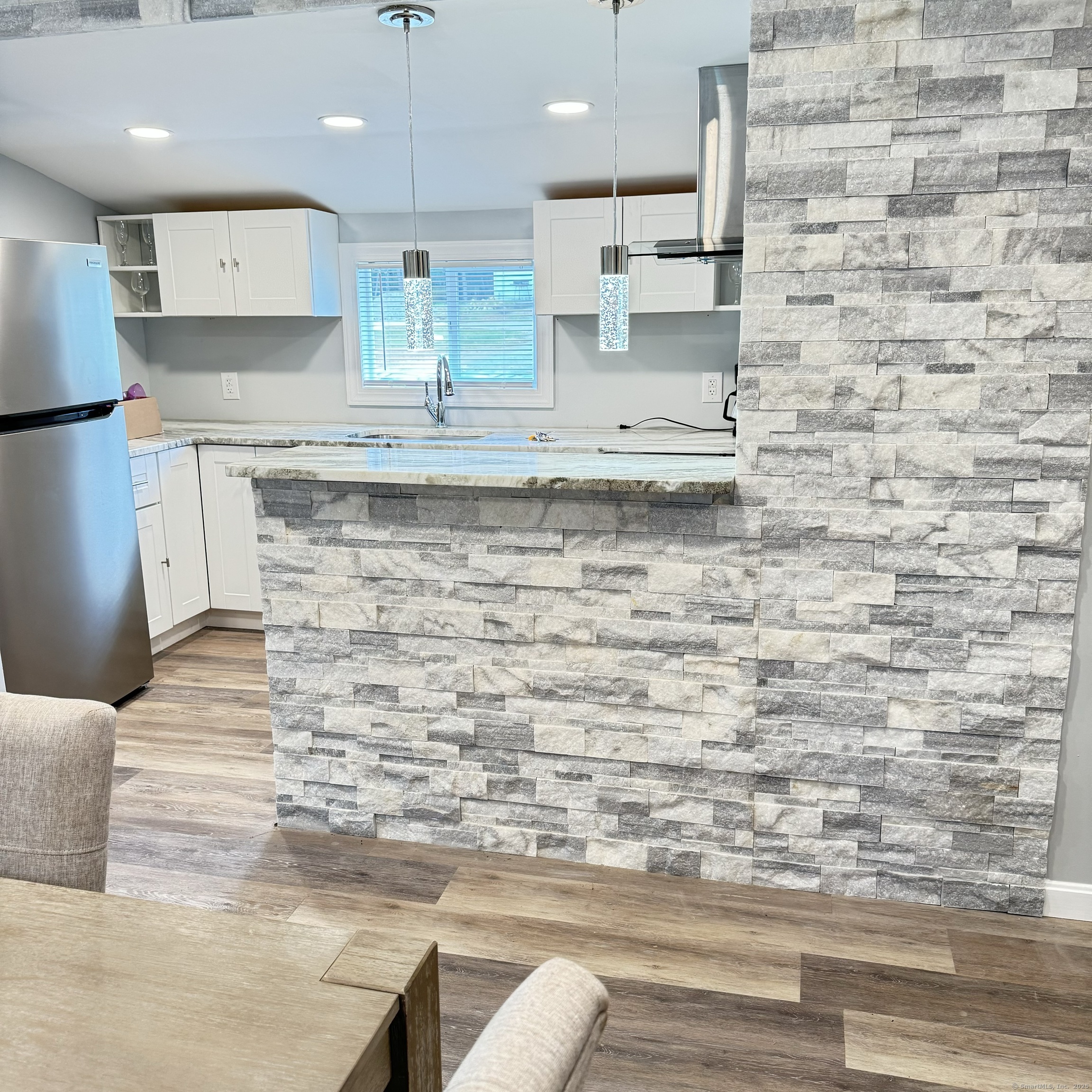 68-70 Black Point Road East Lyme, CT 06357 - Photo 15 of 26 a kitchen with kitchen island sink cabinets and appliances