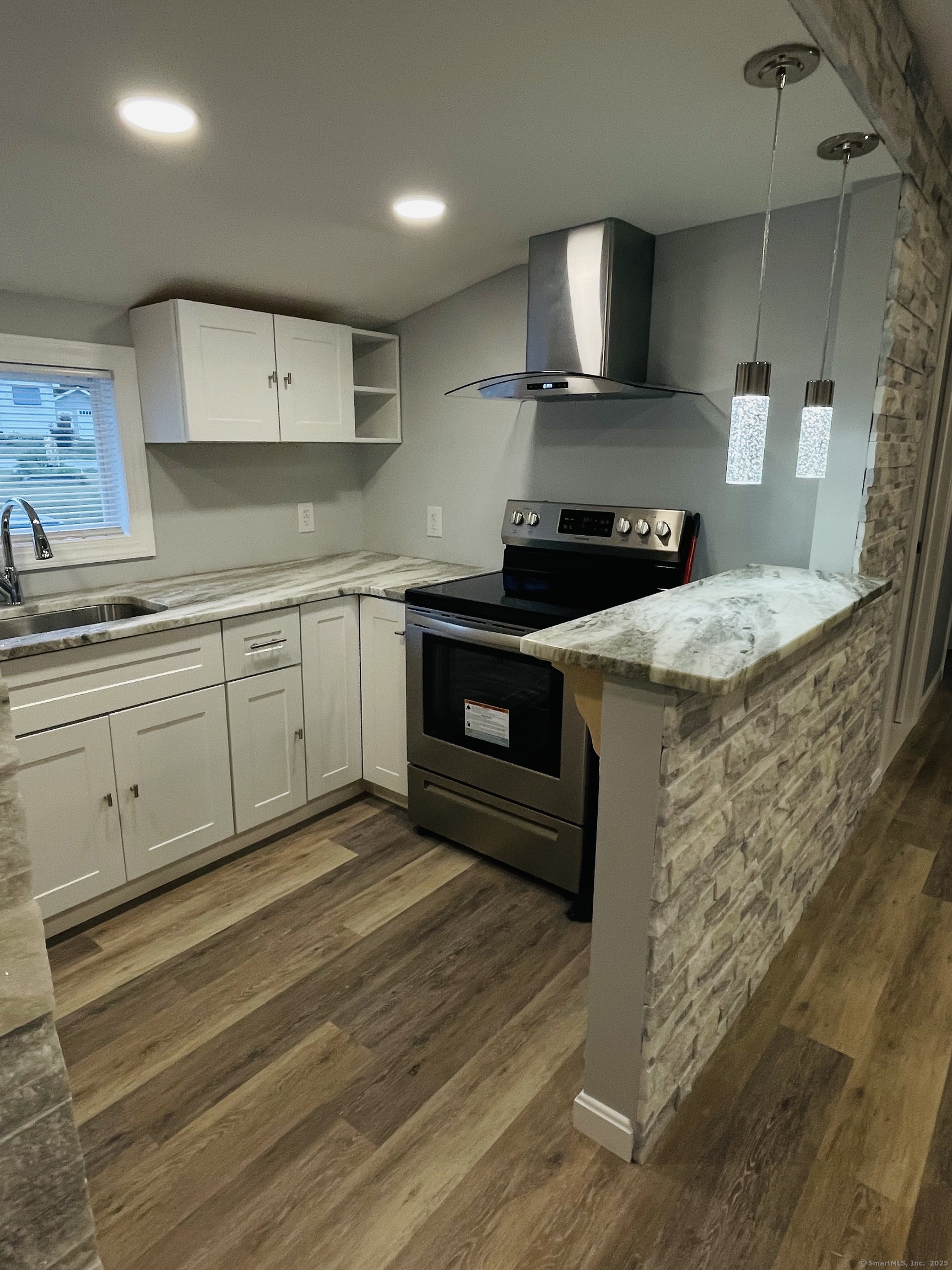 68-70 Black Point Road East Lyme, CT 06357 - Photo 23 of 26 a kitchen with a stove and a sink