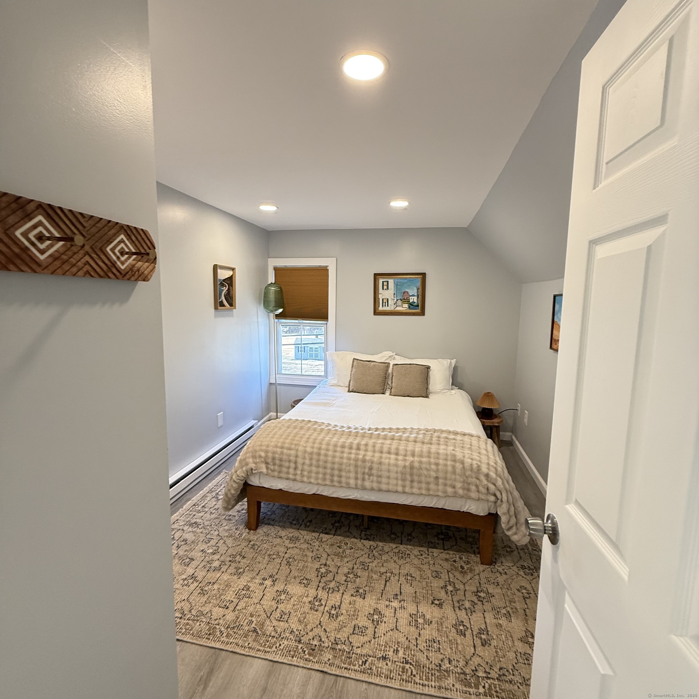 68-70 Black Point Road East Lyme, CT 06357 - Photo 3 of 26 a bedroom with a bed and a window