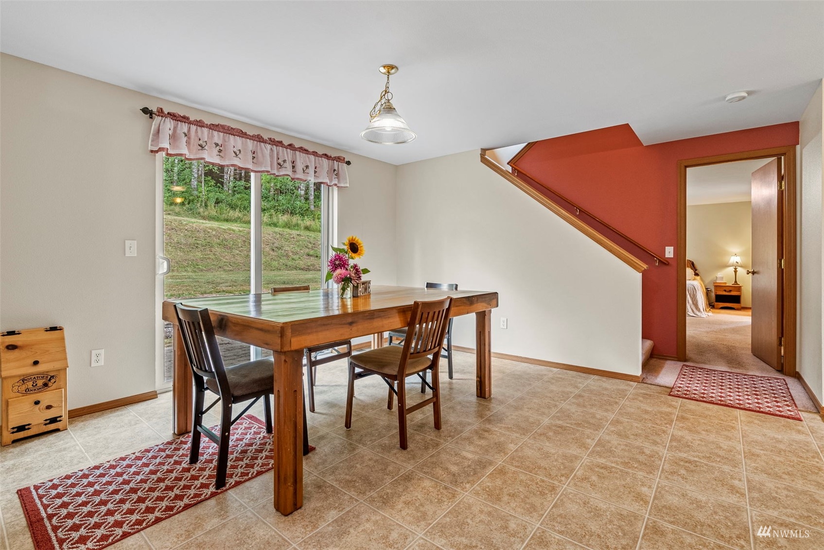658 Smokey Valley Road Toledo, WA 98591 - Photo 19 of 40 a dining room with furniture and a chandelier