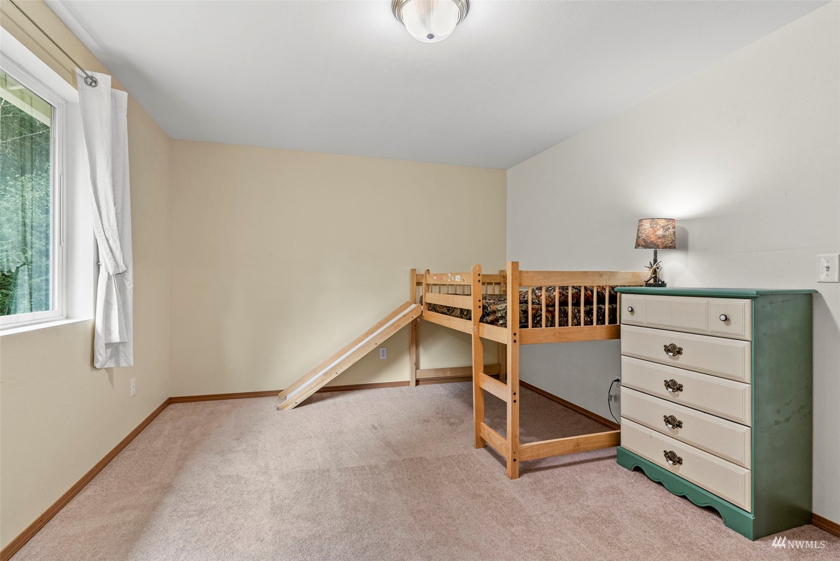 658 Smokey Valley Road Toledo, WA 98591 - Photo 31 of 40 a bedroom with furniture and a window