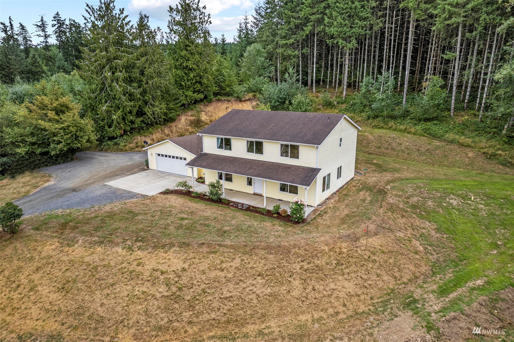 658 Smokey Valley Road Toledo, WA 98591 - Photo 5 of 40 a house with trees in the background