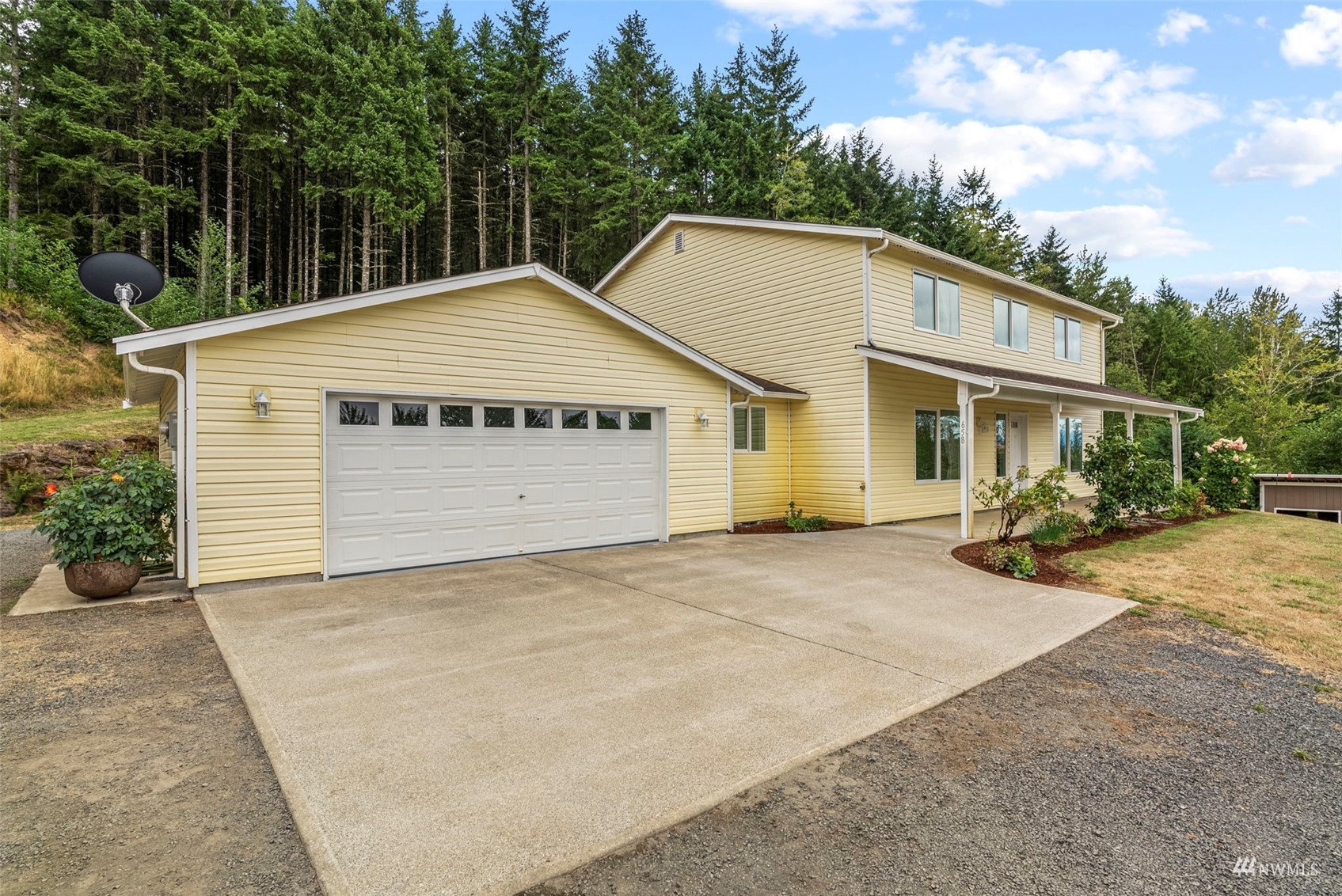 658 Smokey Valley Road Toledo, WA 98591 - Photo 6 of 40 a house with trees in front of it