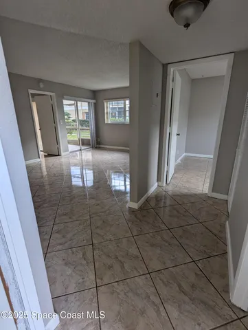 a view of entryway with livingroom