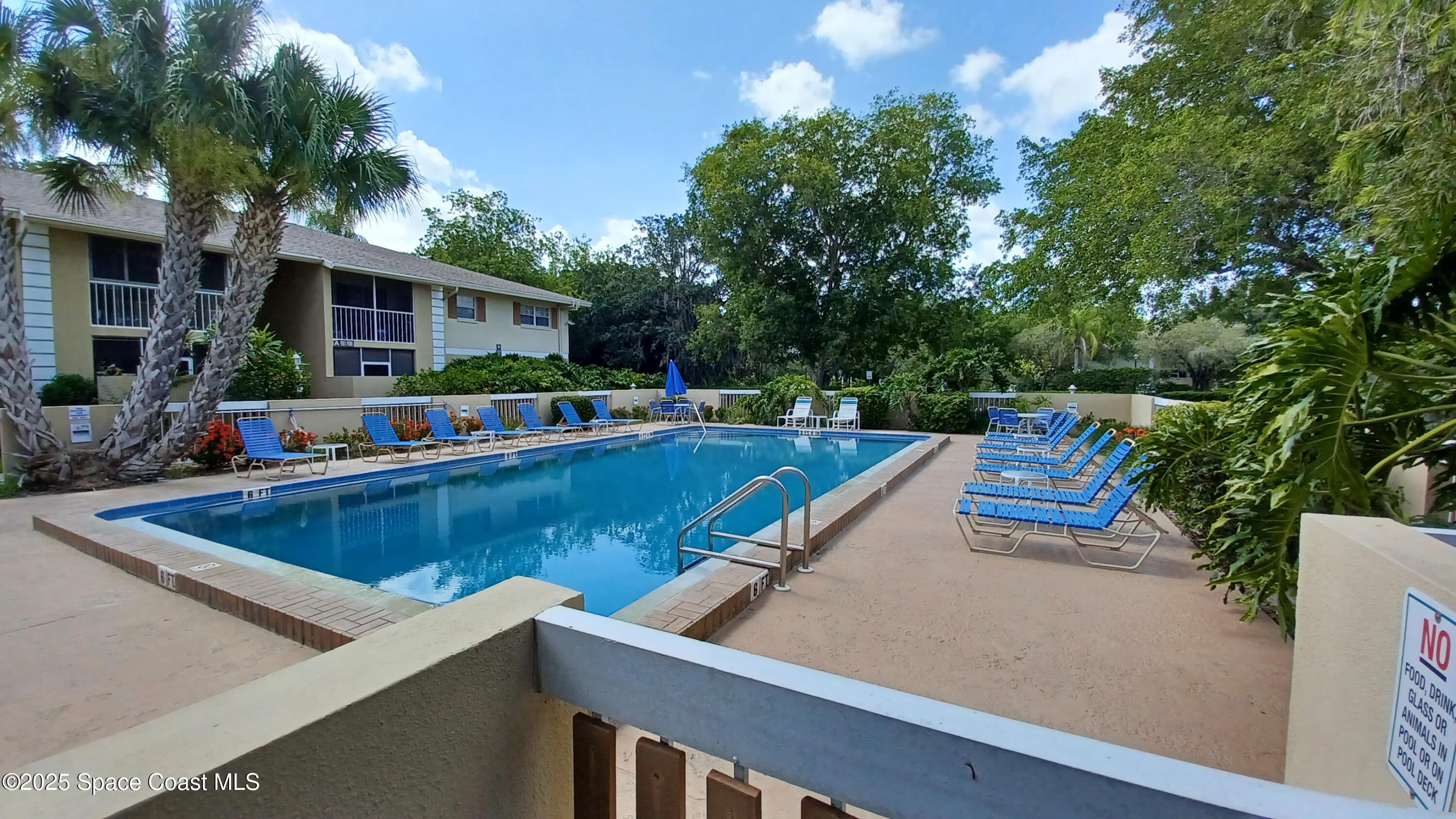 1609 Sunny Brook Lane, Unit E 104 Palm Bay, FL 32905 - Photo 29 of 31 a view of an outdoor sitting area with chairs