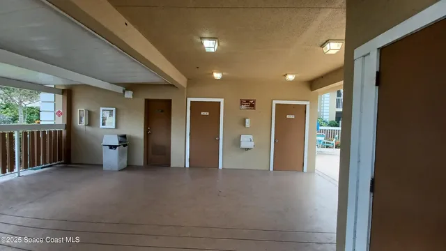 a view of a big room with windows and closet