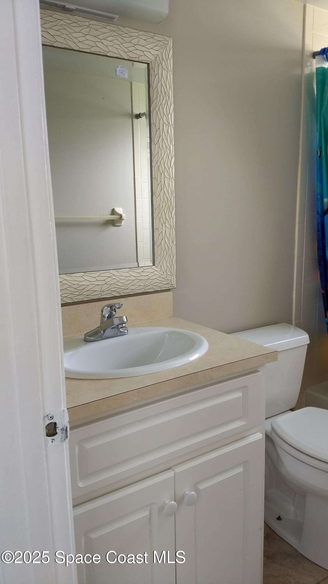 1609 Sunny Brook Lane, Unit E 104 Palm Bay, FL 32905 - Photo 10 of 31 a bathroom with a toilet and a sink