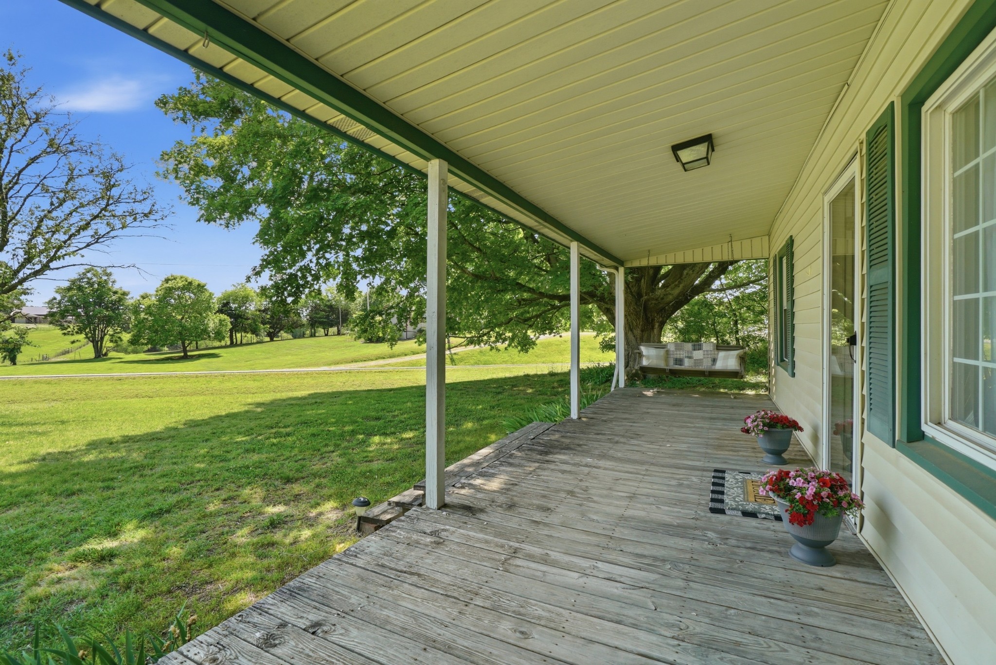 6471 Highway 161 Springfield, TN 37172 - Photo 7 of 57 a view of a porch with wooden floor and fence
