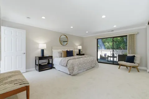 a bedroom with a bed and furniture