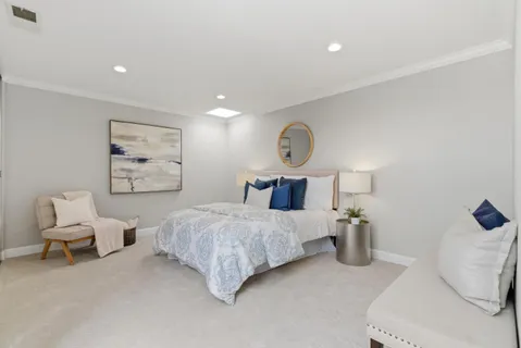 a bedroom with a bed and chair