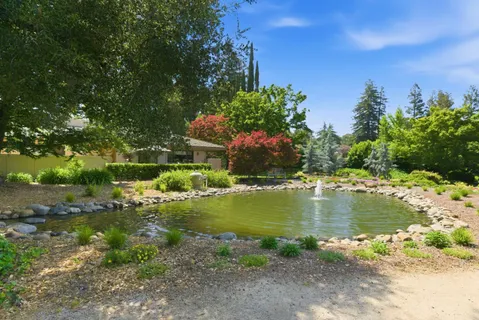 a view of a lake with a yard