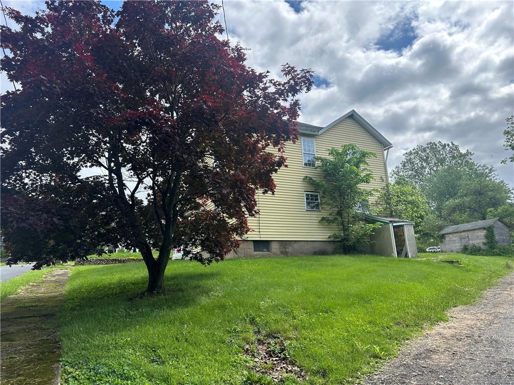 112 Laughlin Street Dawson, PA 15428 - Photo 14 of 15 a view of a house with a yard