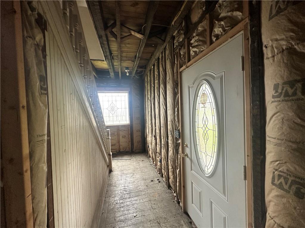 112 Laughlin Street Dawson, PA 15428 - Photo 2 of 15 a view of a hallway with wooden floor and windows