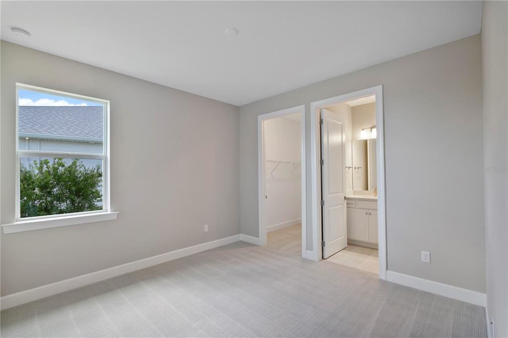 16056 Shoreline Drive Punta Gorda, FL 33982 - Photo 29 of 57 an empty room with windows and closet