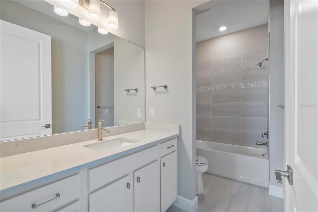 16056 Shoreline Drive Punta Gorda, FL 33982 - Photo 31 of 57 a bathroom with a sink a toilet and shower