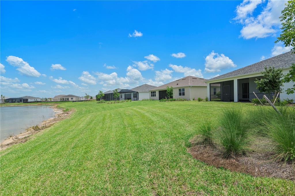 16056 Shoreline Drive Punta Gorda, FL 33982 - Photo 36 of 57 a view of a house with a big yard
