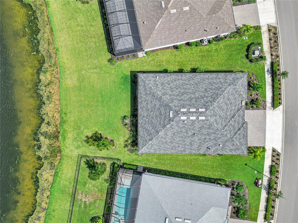 16056 Shoreline Drive Punta Gorda, FL 33982 - Photo 39 of 57 a view of a yard with potted plants