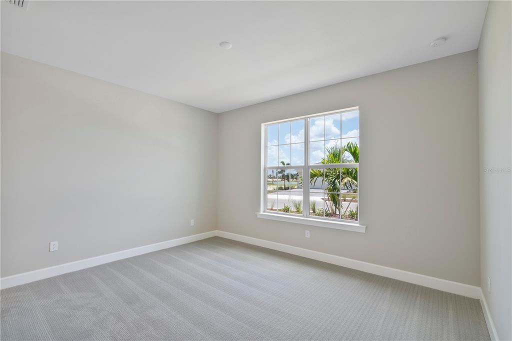 16056 Shoreline Drive Punta Gorda, FL 33982 - Photo 5 of 57 an empty room with windows