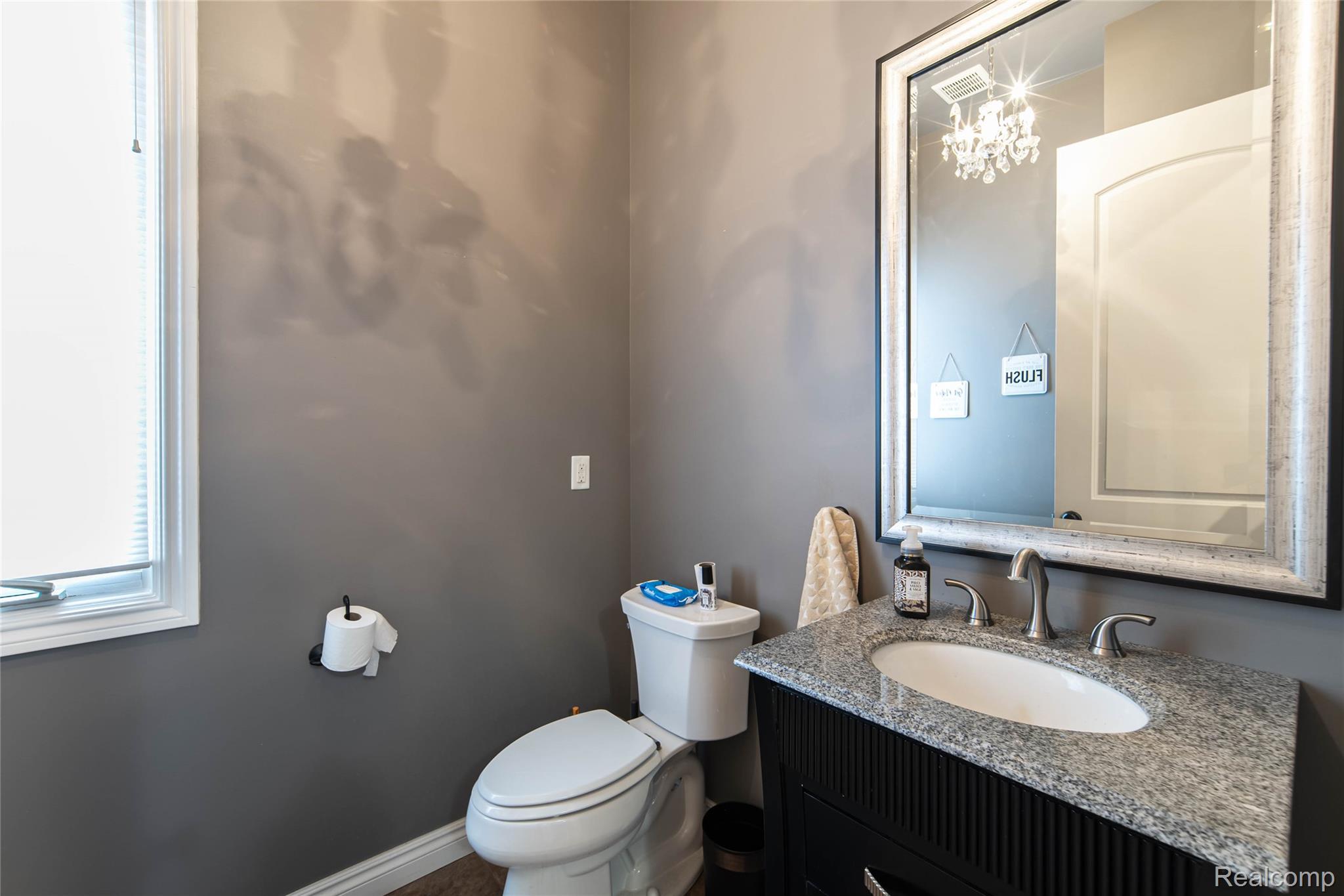 67102 Rachael Lane Washington, MI 48095 - Photo 24 of 37 Half bathroom with toilet and vanity
