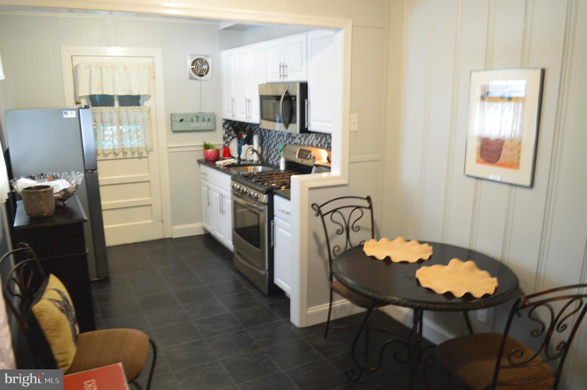 421 Dutton Mill Road, Unit 421 Brookhaven, PA 19015 - Photo 4 of 18 dining room and kitchen