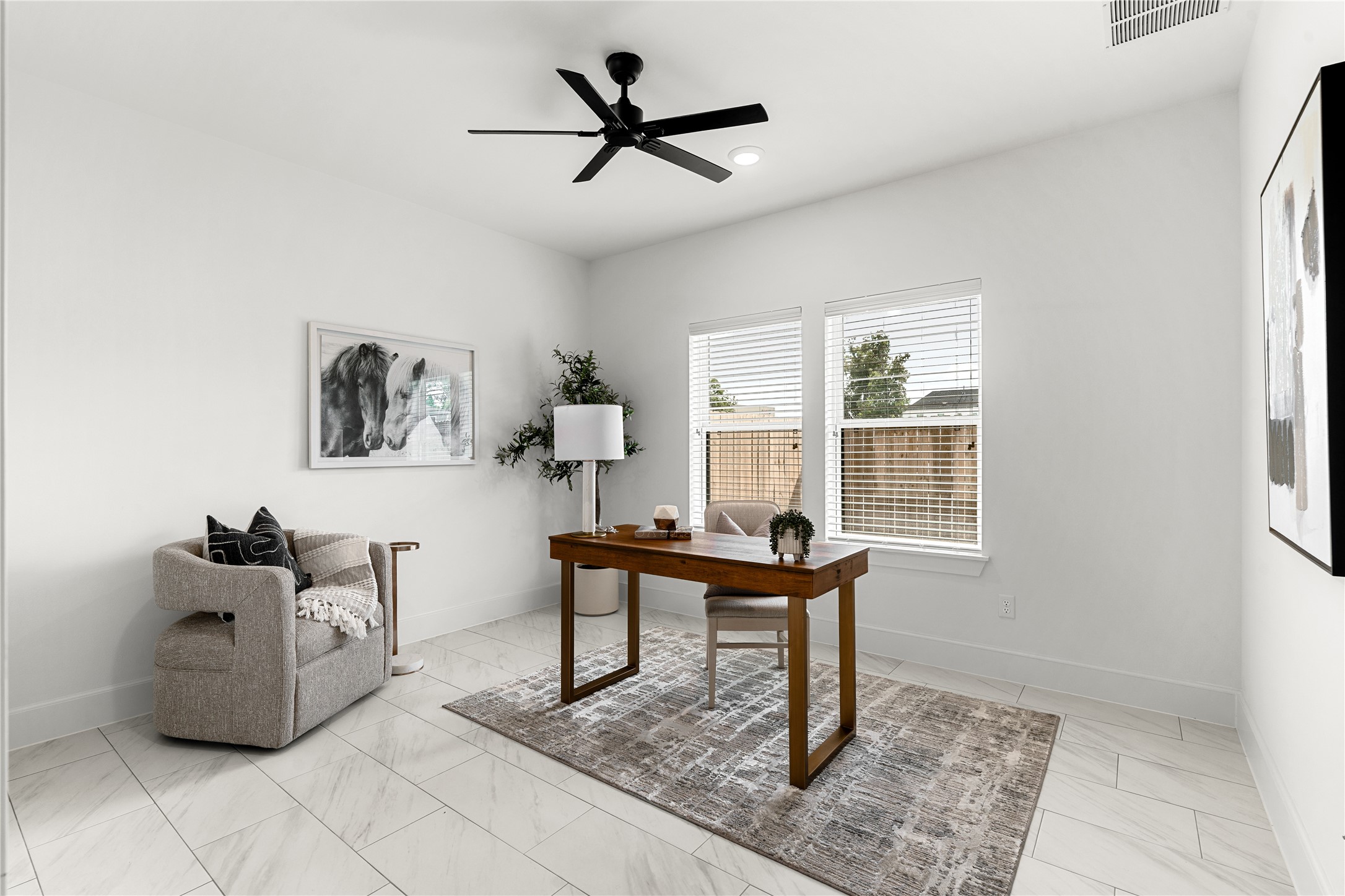 1614 Ojeman Road, Unit C Houston, TX 77055 - Photo 7 of 48 First floor bedroom featuring white walls, large windows, and a ceiling fan.
