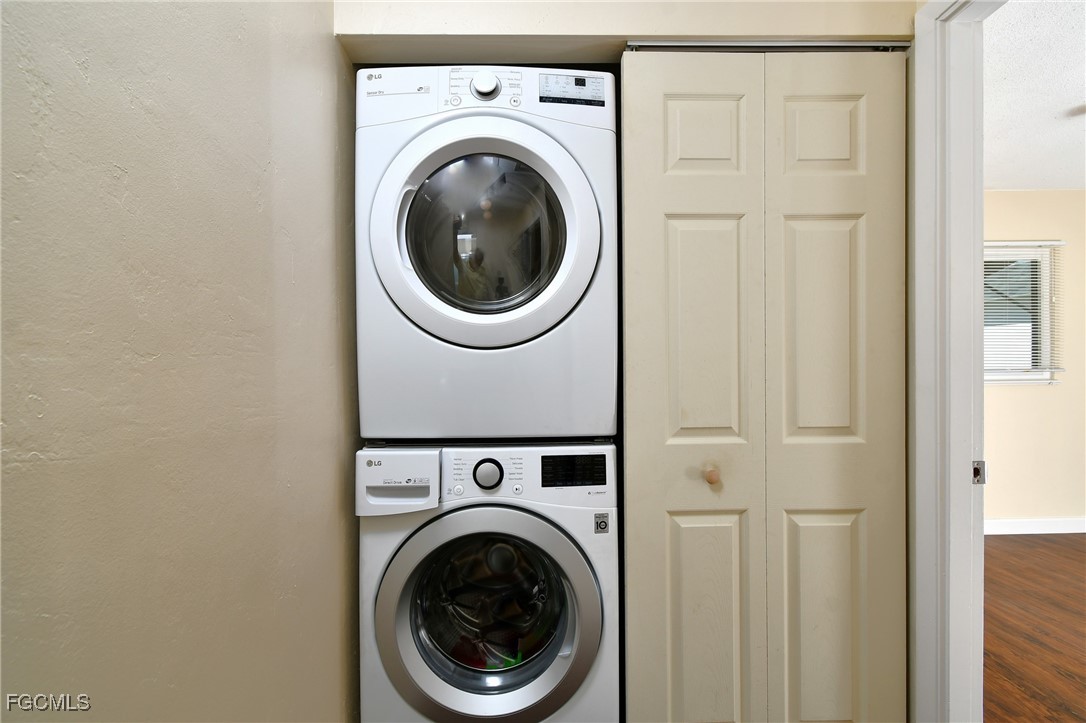 13 Hamlin Court Lehigh Acres, FL 33936 - Photo 19 of 31 a utility room with dryer and washer