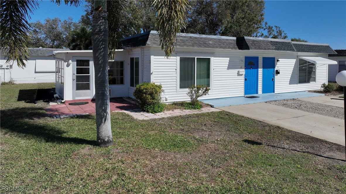 13 Hamlin Court Lehigh Acres, FL 33936 - Photo 2 of 31 a front view of a house with garden
