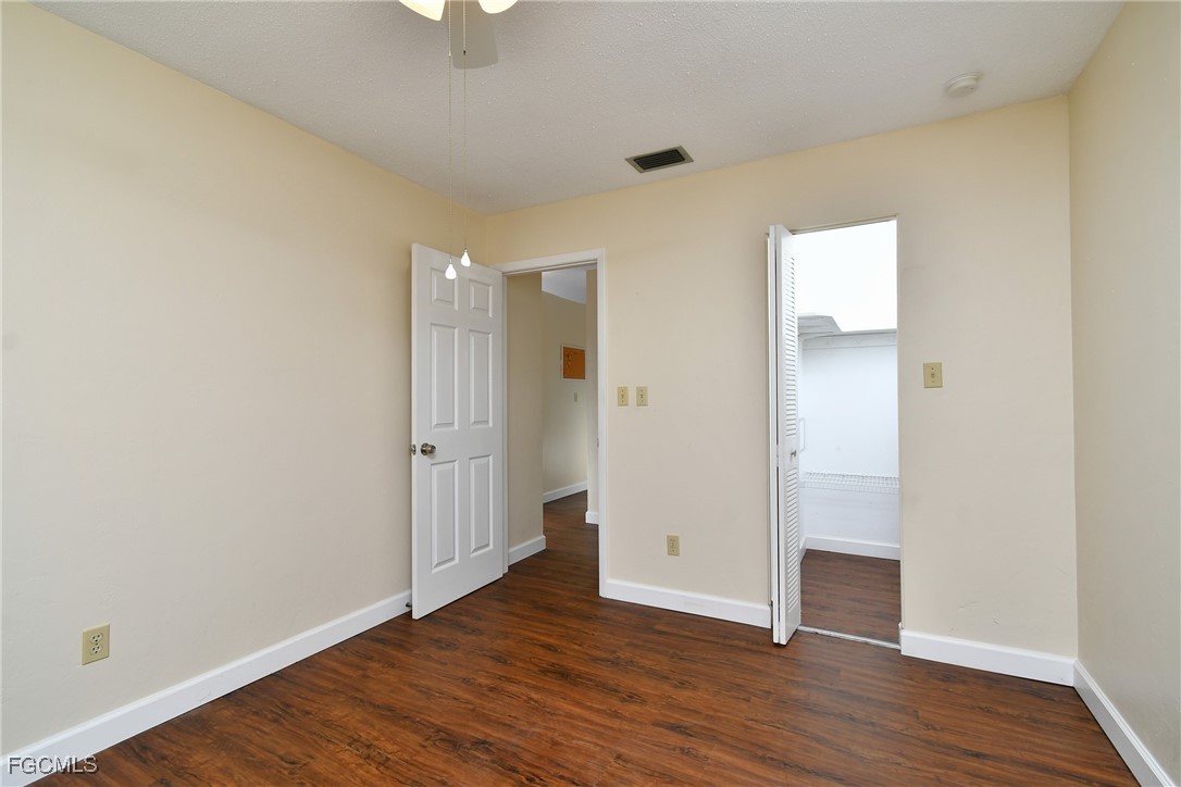 13 Hamlin Court Lehigh Acres, FL 33936 - Photo 21 of 31 wooden floor in an empty room